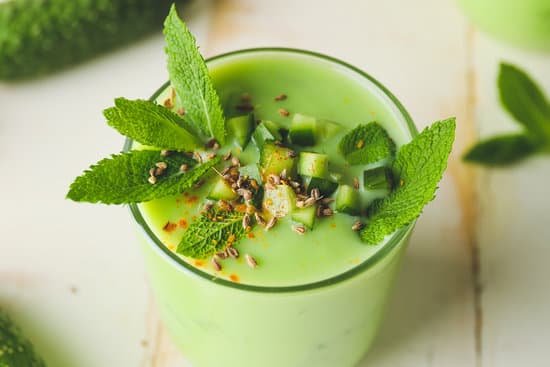 canva glass with cold cucumber soup placed on a table MAD7pP8gpqo
