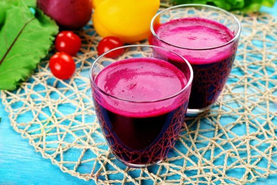 canva glasses of beet juice with vegetables on a table MAD MdZ4Wkg