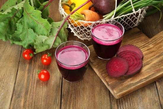 canva glasses of beet juice with vegetables on table MAD MaDihwg