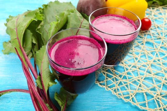 canva glasses of beet juice with vegetables on table MAD Mazvc k