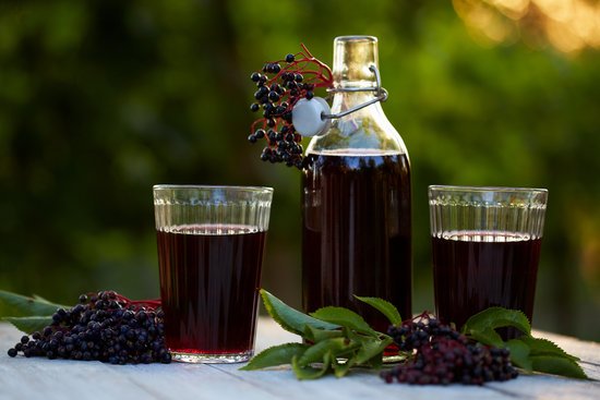 canva glasses of fresh elderberry syrup and elderberries MADFlh7Go3Y