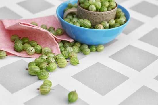 canva gooseberries with cup and bowl on table MAD Q3rR so