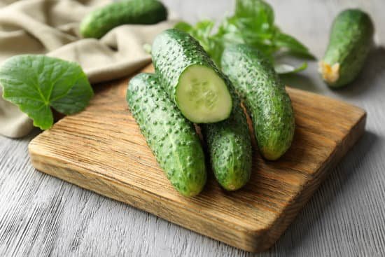 canva green fresh cucumbers on wooden board MAD9bh4PIus