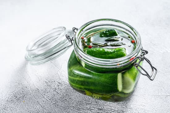 canva green pickle cucumbers in a glass jar. MAEQrtM9ll8