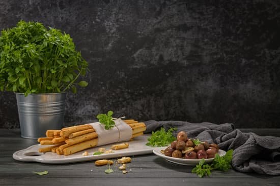 canva grissini bread sticks with basils and mushrooms on table MAD gfZaaVM