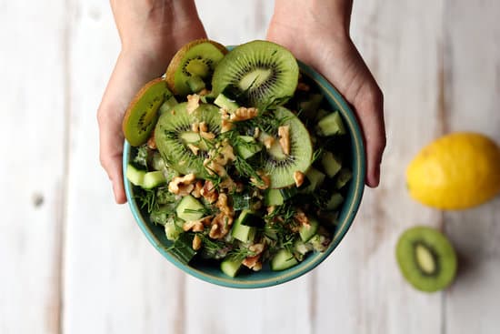 canva hands holding bowl of kiwi salad MAEA kiKBL0