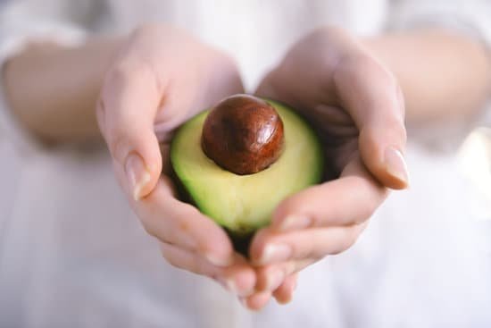 canva hands holding fresh avocado closeup MAD QpRaqO4