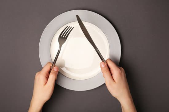 canva hands with cutlery and empty plate MAD QuwMdh8