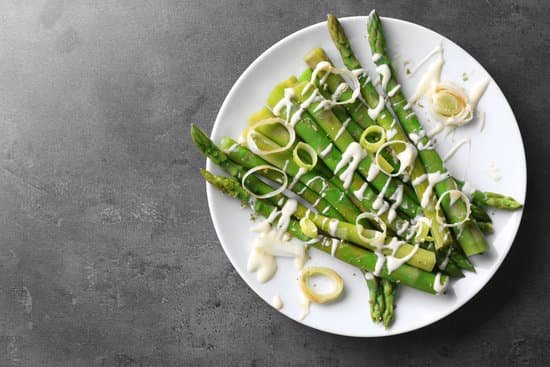 canva healthy asparagus dish with sliced onion on white plate MAD Mhz dZY