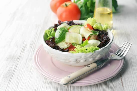 canva healthy salad with cucumbers in bowl on table MAD9T1n9 TA