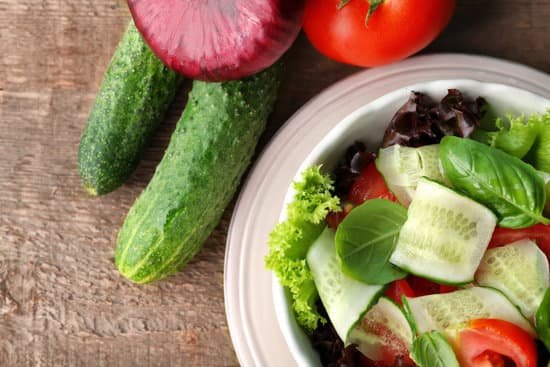 canva healthy vegetable salad with cucumbers in plate close up MAD9T9VeSbs