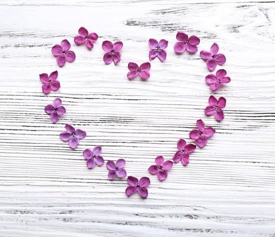 canva heart made with lilac flowers on wooden background MAD Qhydckc