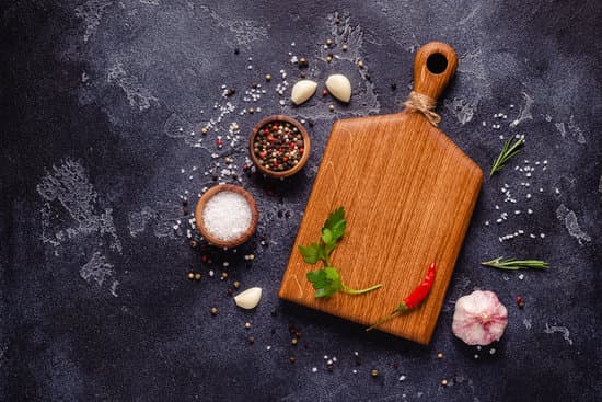 canva herbs and condiments on black stone background MAENUISIYcY