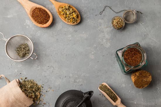canva herbs with wooden spoon in gray slate background MAECCwYrSsk