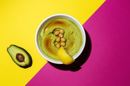 canva homemade avocado and chickpea hummus in a bowl MAD mUG0ydk