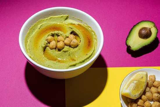 canva homemade avocado and chickpea hummus in a bowl MAD s5Z8ps4