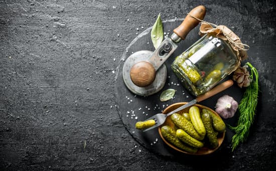 canva homemade preserved cucumbers on a stone board MAEP4OfkHts