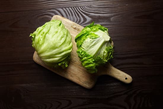 canva iceberg lettuce on cutting board in wooden table top view MAD xZ 9 hU