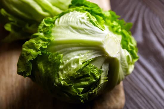 canva iceberg lettuce on wooden cutting board MAEAGFaDs8k