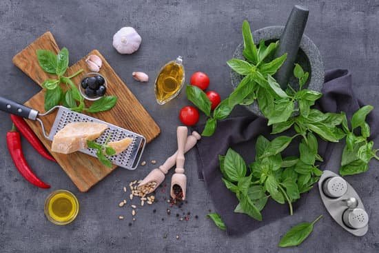 canva ingredients for basil pesto sauce on gray background MAD9UBKDXpo