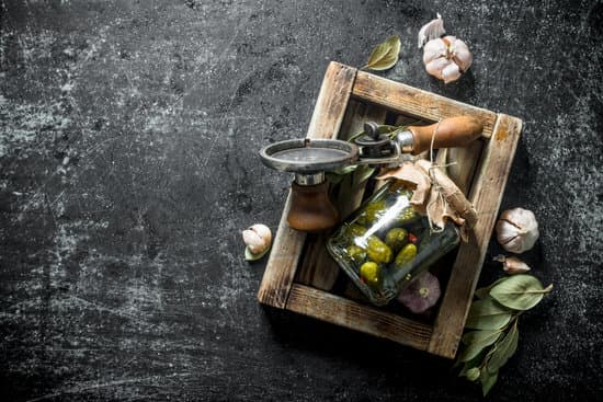 canva jar of pickled cucumbers on a wooden tray flatlay