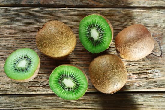 canva juicy kiwi fruit on wooden background MAD MSW TAQ