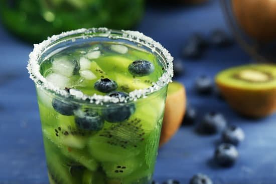 canva kiwi and blueberry cocktail on a table MAD MjQk2cY