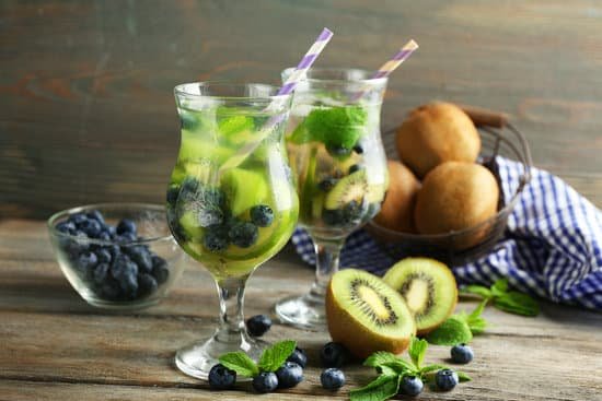 canva kiwi and blueberry cocktails with fruits on wooden background MAD MuP0oLg