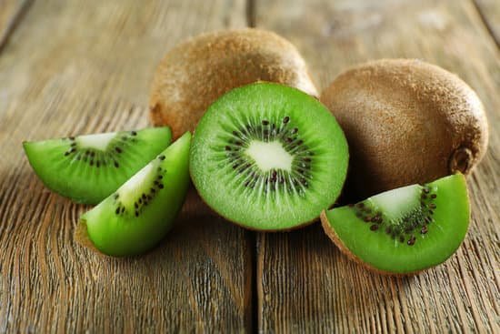 canva kiwi fruit on a wooden table MAD MeiIfAo