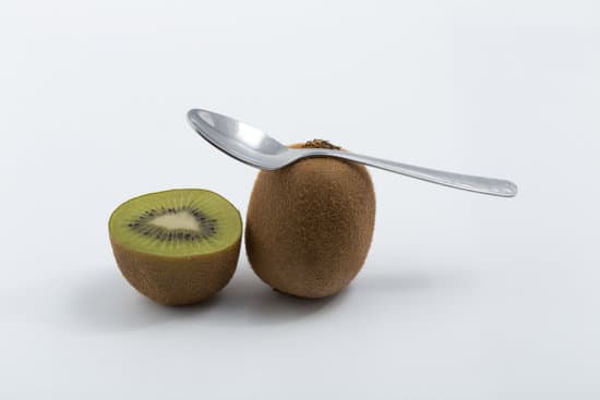 canva kiwi fruits and spoon on white background MAEliDzmOZw