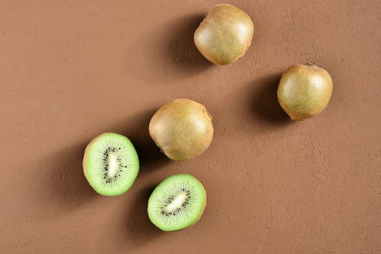 canva kiwi fruits on brown surface MAEOuLlno84