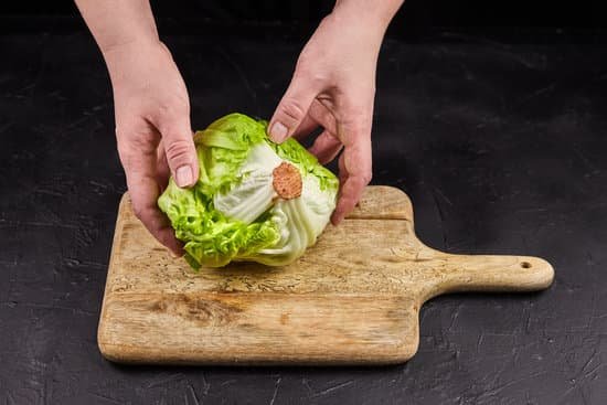 canva lettuce on a wooden chopping board MAEHMyj7p20