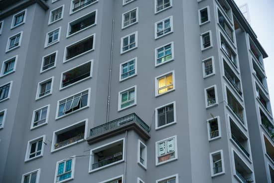 canva light in a single window of an apartment building