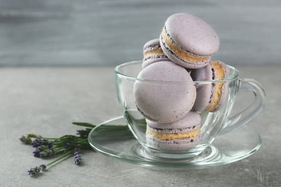 canva macaroons in glass cup and lavender on table MAD Q1m cR8