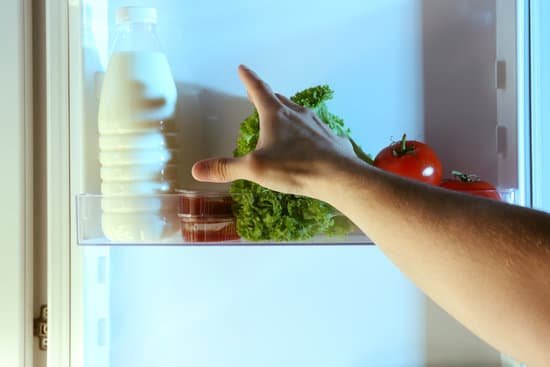 canva male hand choosing food in kitchen. hunger concept MAEserwV05I