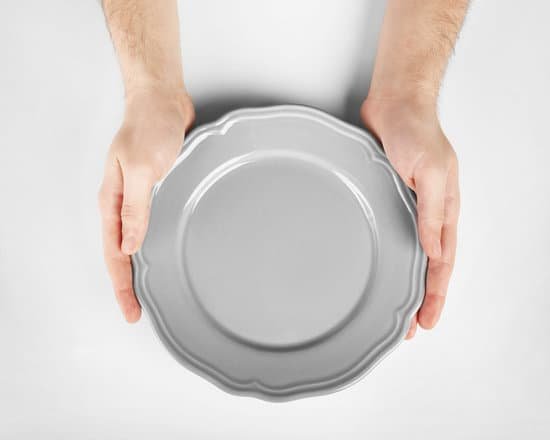 canva male hands holding grey plate isolated on white MAEr6yeY Wo