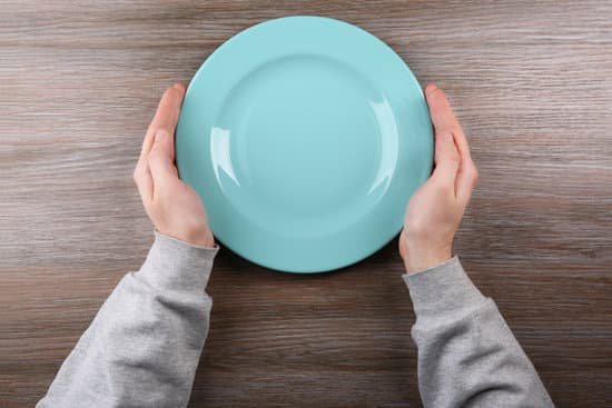canva man holding empty plate. hunger concept MAEsBTT1DgU