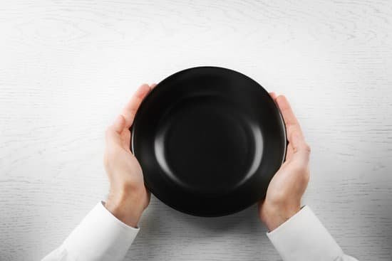 canva man holding empty plate. hunger concept MAEsBWSXGJY