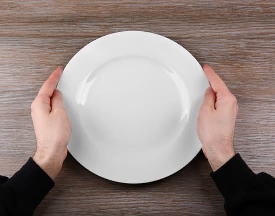 canva man holding empty plate. hunger concept MAEsBe0ue5A