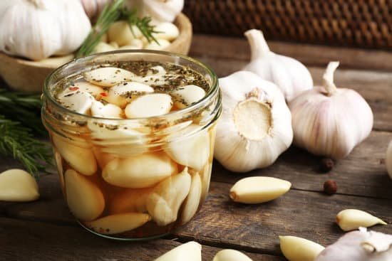 canva marinated garlic in a glass jar MAD NK0X5oY