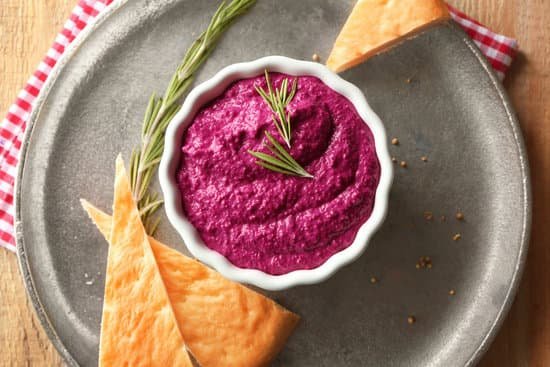 canva metal plate with beet hummus and bread MAD9brv7efk