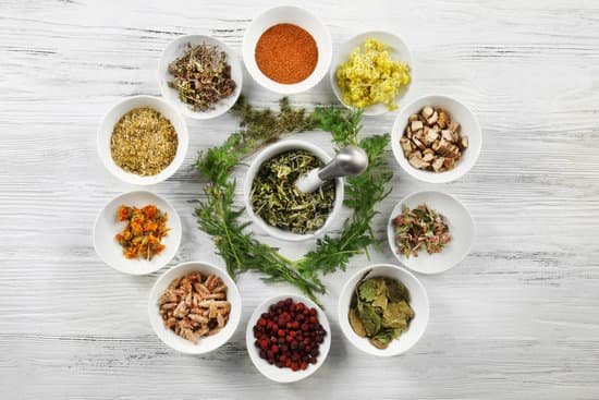 canva natural flowers and herb selection in bowls on wooden background MAD Q5YEXE8