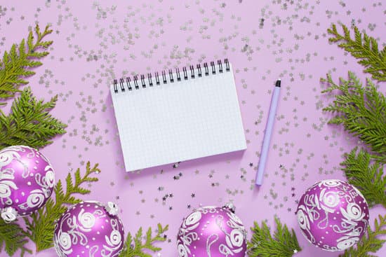 canva notebook with christmas decorations on lilac background MAEQ3MiEuSk