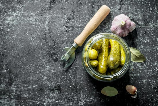 canva open jar with preserved cucumbers with garlic. MAEPiv c6uY