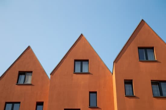 canva orange apartments against the blue sky MAEBQOeBosg