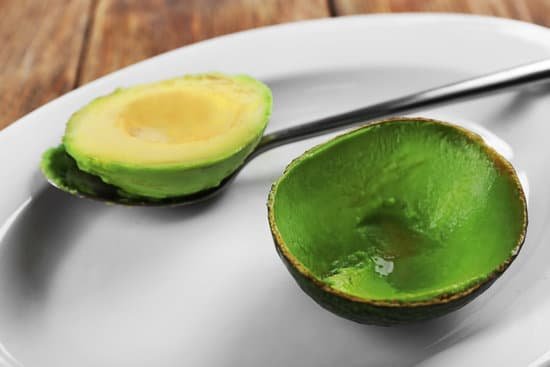 canva peeled fresh avocado on plate closeup MAD QltmyYo