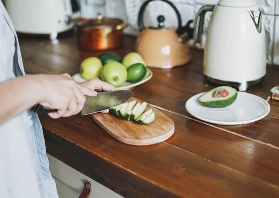 canva person cutting avocado in the kitchen MAD HzTmNoA