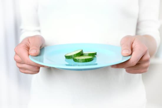 canva person hands holding a plate with slices of cucumber MAD QrEb9OQ