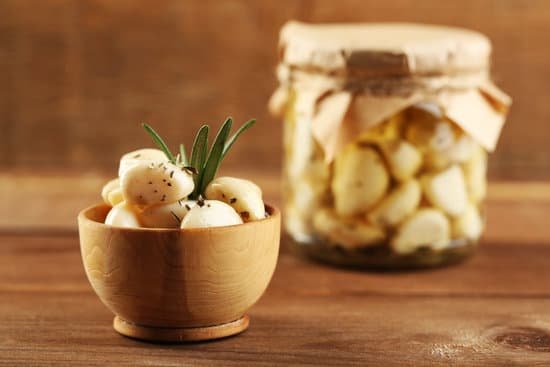 canva picked garlic in glass jar and bowl MAD