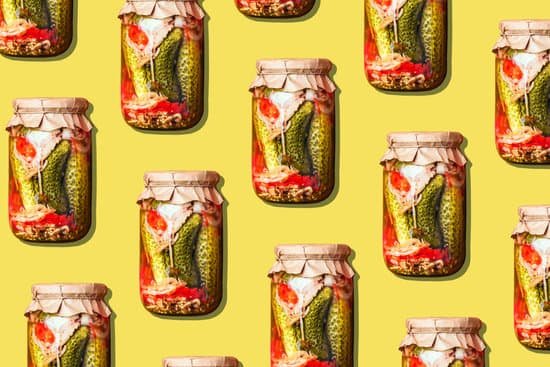 canva pickled cucumbers in glass jars on yellow background MAD71cqXbJs